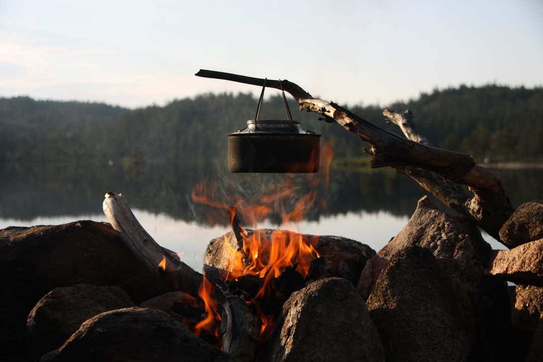 Photo illustrating Soto’s Amicus stove with compatible hard-anodized aluminum cookware in use, empha
