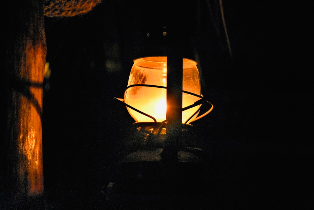 A captivating night-time campsite scene featuring a Japanese-style lantern from either Captain Stag