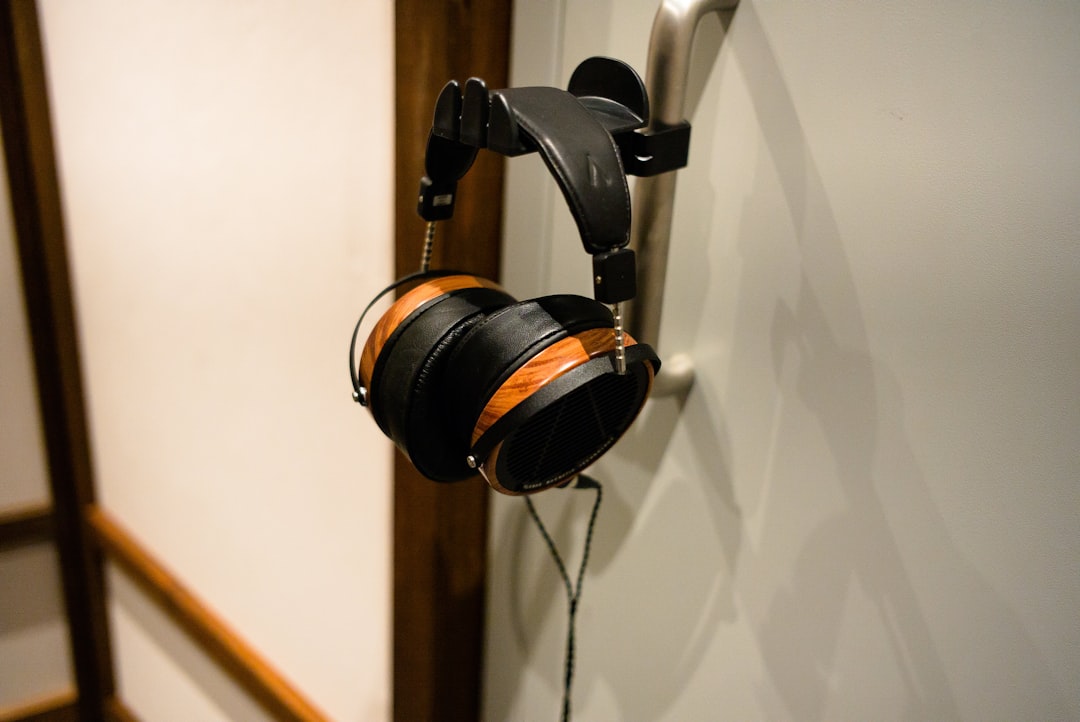 Image showcasing Audio-Technica ATH-M50x headphones with detachable cables displayed, emphasizing it