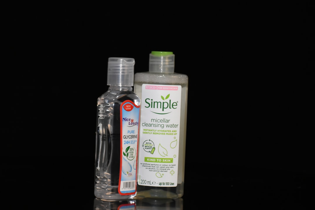 Comparison infographic style image or side-by-side product shots of SK-II GenOptics Aura Essence and