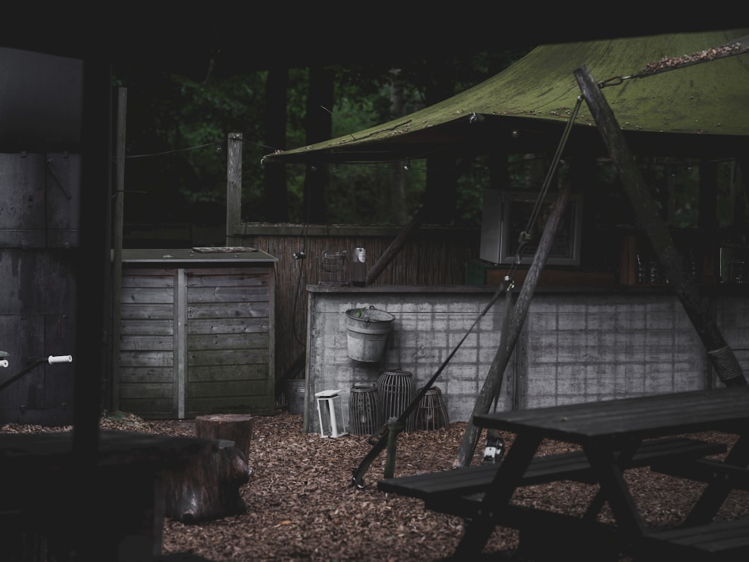 A hero image of a Japanese-style outdoor cooking setup featuring Uniflame and Snow Peak cookware arr