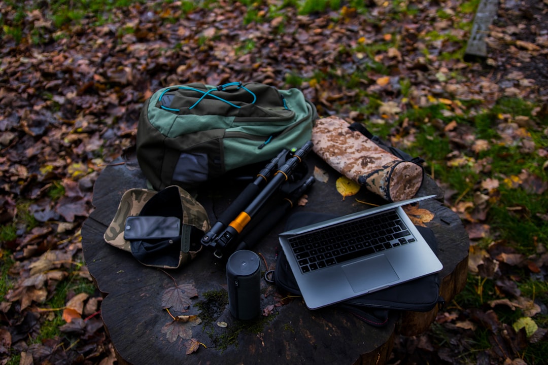 Photograph of an outdoor journaling setup featuring a Tombow Mono Graph mechanical pencil, a Midori