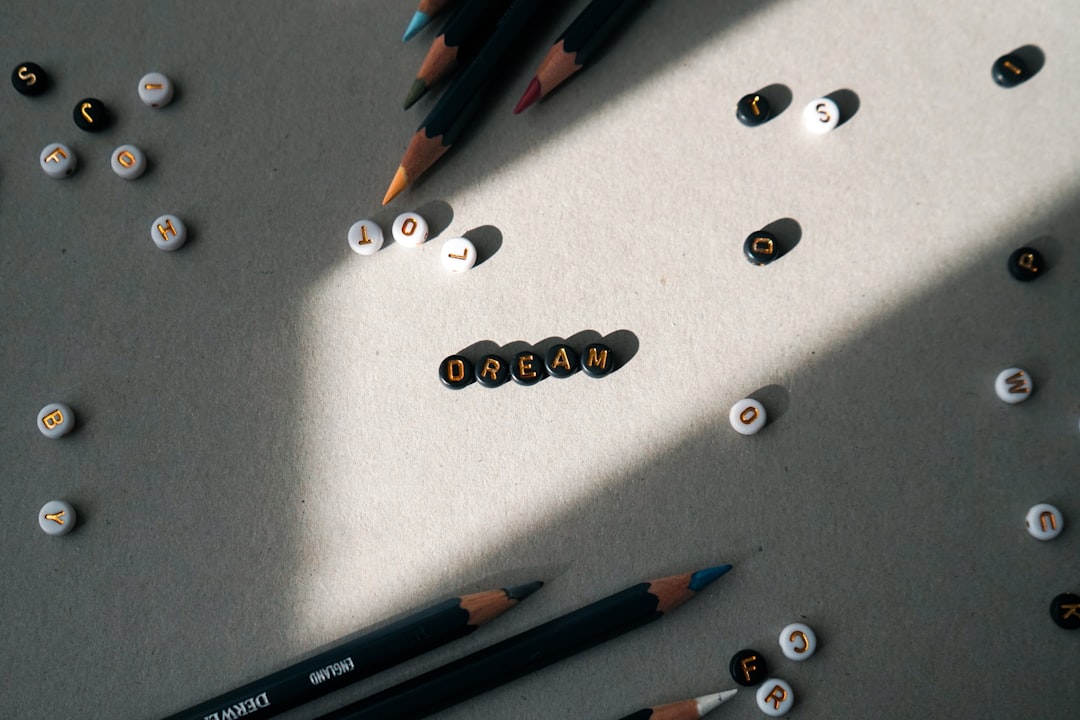 A high-resolution, artistic flat lay of the three highlighted Japanese mechanical pencils (Pentel Gr