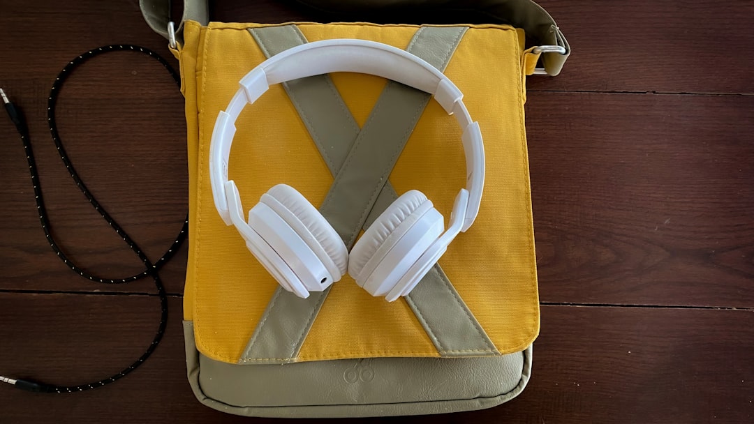 Image of Sony WF-1000XM4 true wireless earbuds in their charging case placed on a commuter’s backpac