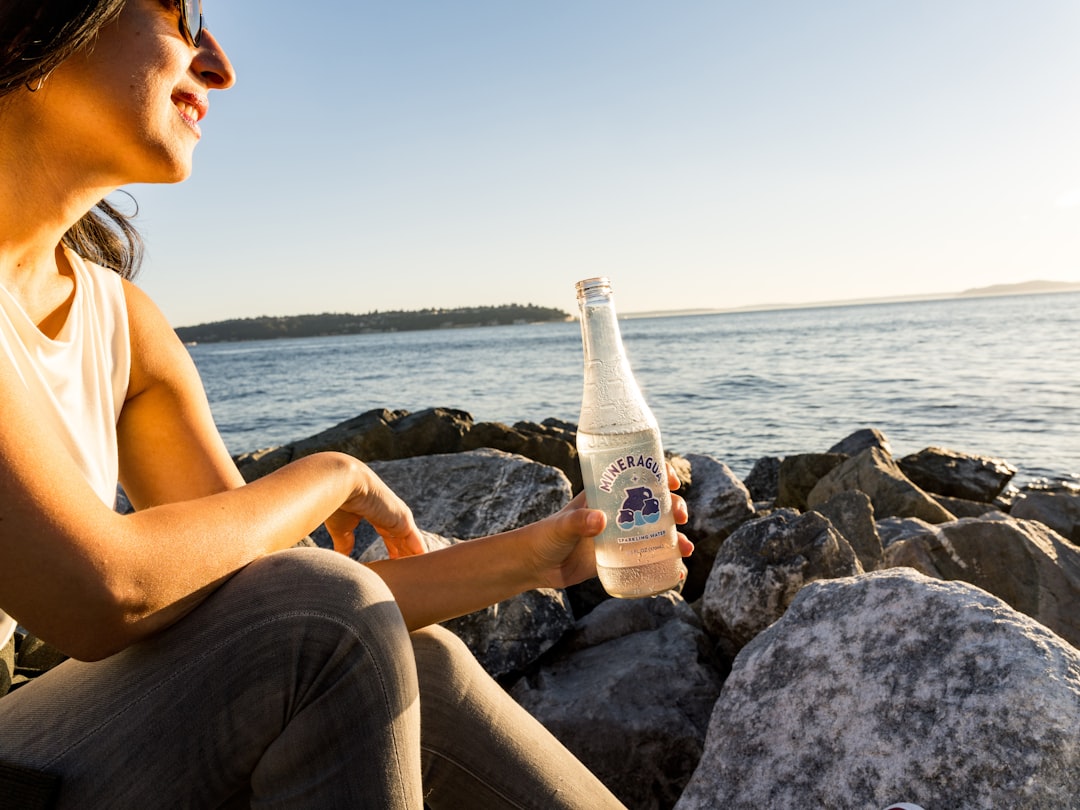 A high-quality hero image showing both SK-II Facial Treatment Essence and Shiseido Ultimune Power In