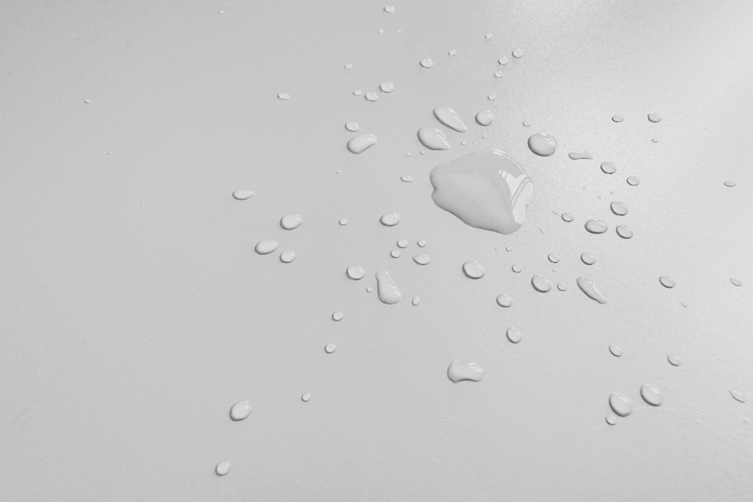 A clean, minimalist hero image featuring a selection of Hada Labo products arranged simply on a whit