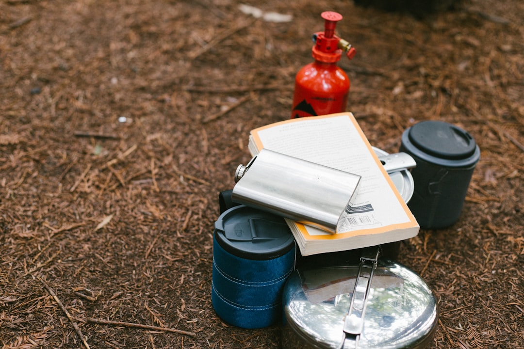Photo showing Snow Peak Field Journal in an outdoor setting, placed on a rock or camping gear with v