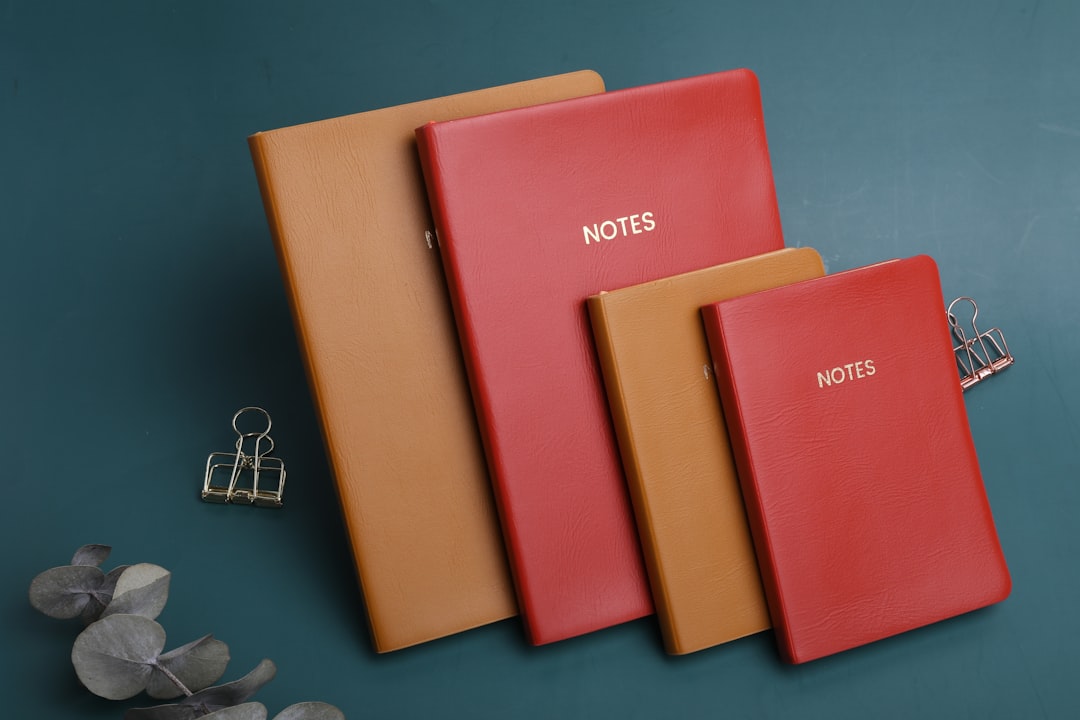 A flat lay image featuring a selection of the highlighted Japanese notebooks and planners (Hobonichi