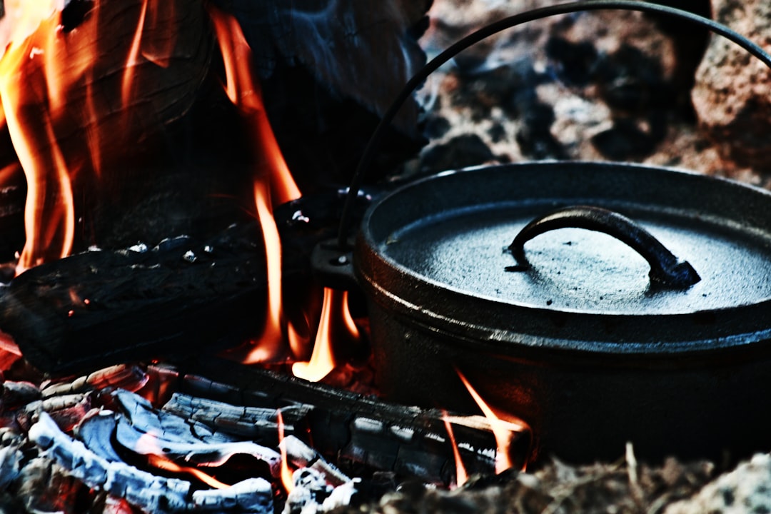 Image showing Captain Stag cookware in action on a camp stove with visible simmering soup or frying 