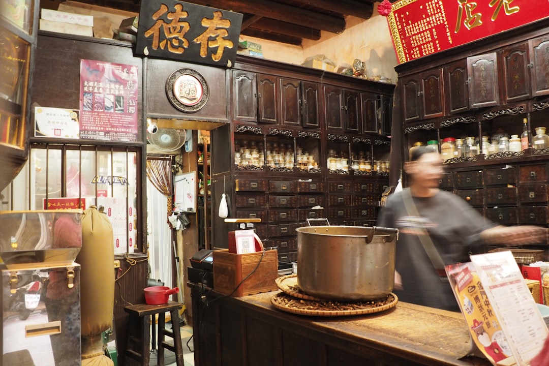 A high-quality, inviting image featuring a sleek Japanese rice cooker (preferably Zojirushi or Tiger