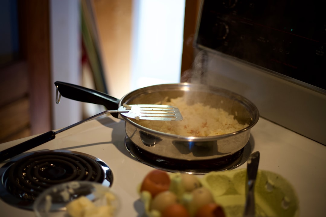 A beautifully styled kitchen scene featuring a Zojirushi rice cooker prominently on a countertop, wi