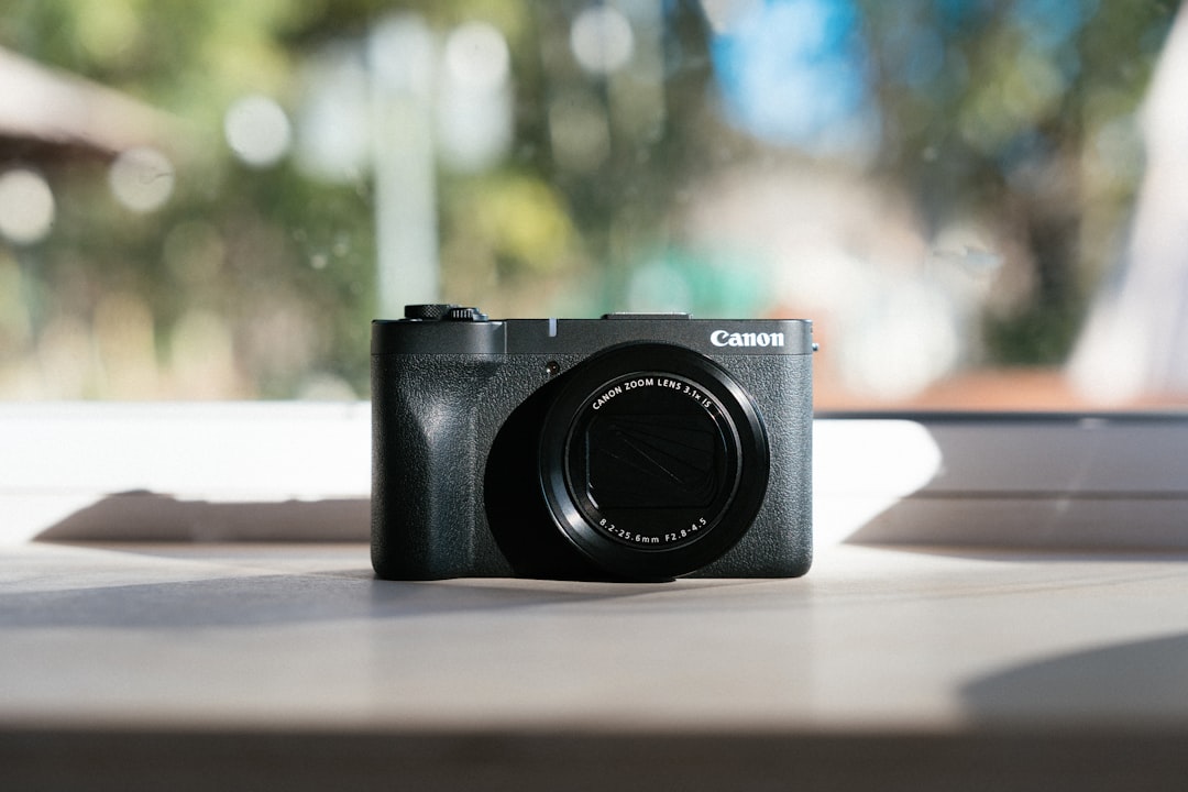 Close-up product shot of the Panasonic Lumix TZ200 / ZS200 camera highlighting its compact size and 