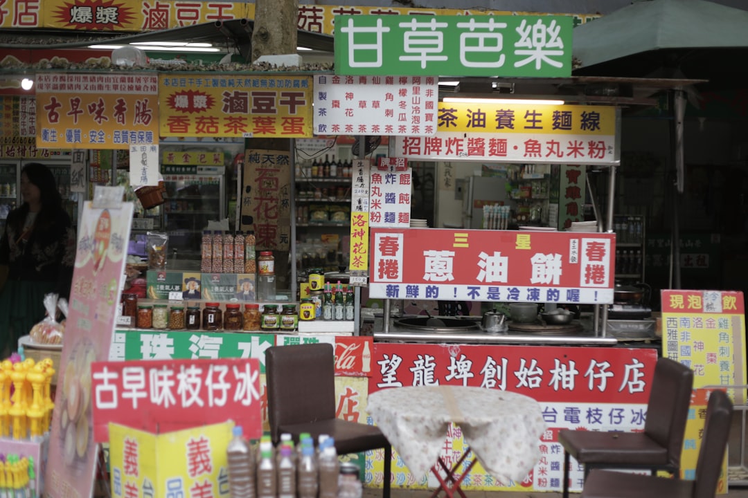 Photo of a Japanese skincare store shelf or display featuring Hada Labo products alongside other Asi