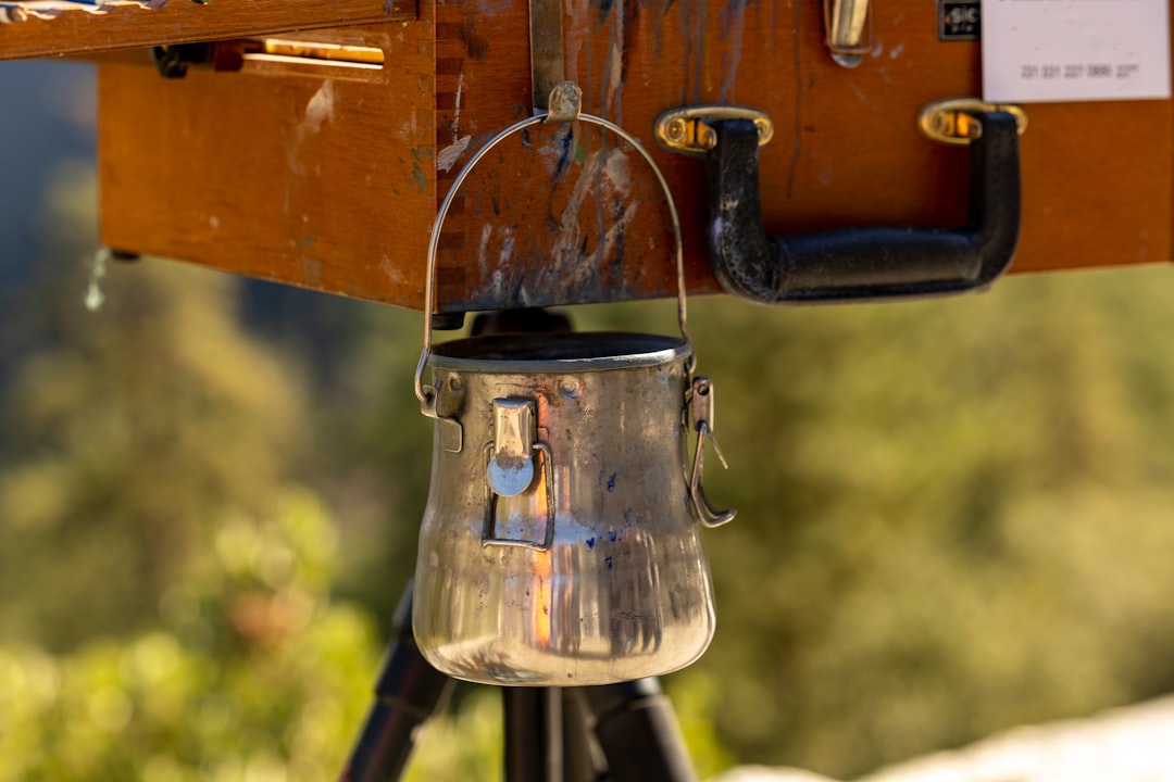 Close-up image of the Soto Muka lantern charging via USB-C cable outdoors, emphasizing the rechargea