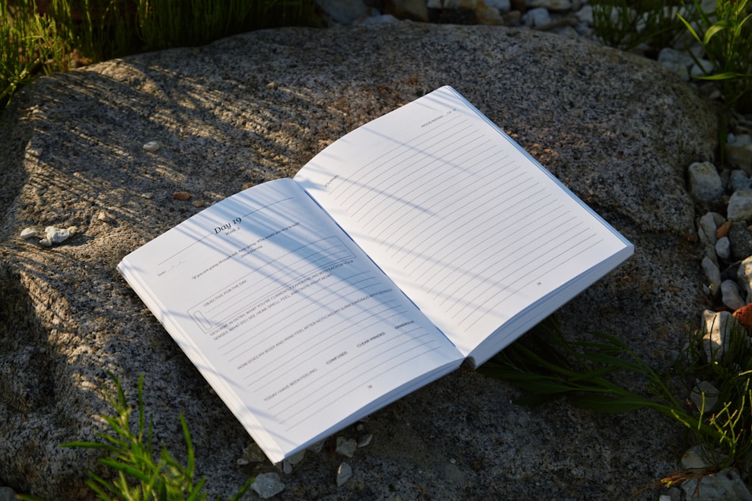 Image showcasing the Uni Mitsubishi Jetstream notebook and planner with a hard cover, open to a clea