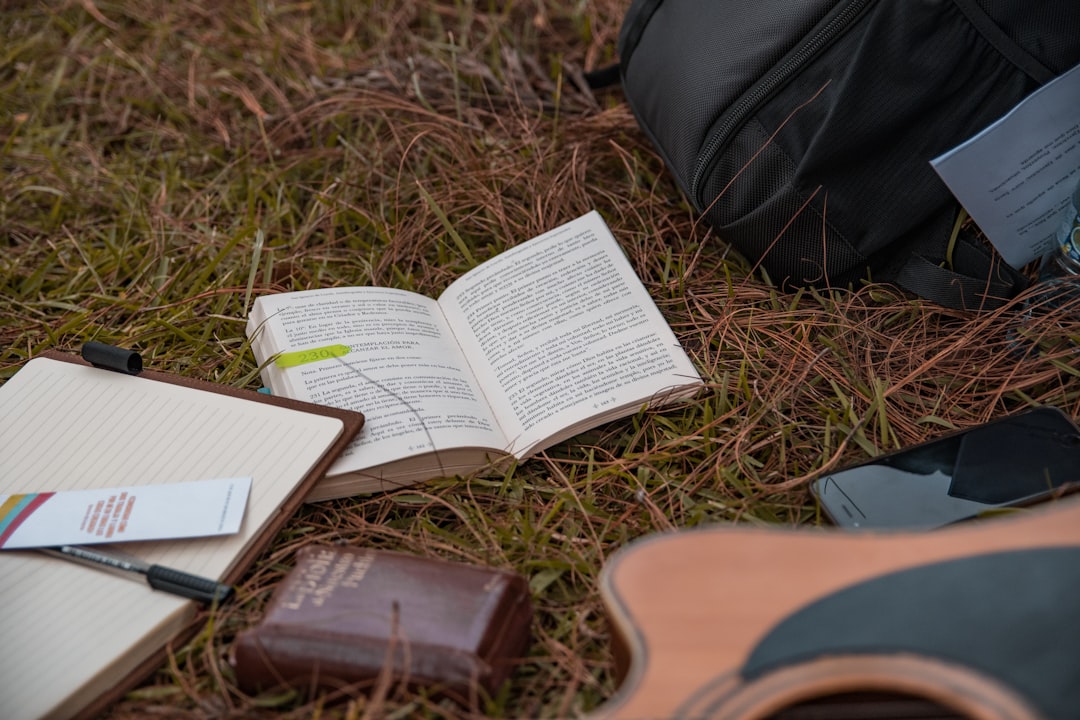 A hero image showing a Midori Traveler’s Notebook with a leather cover resting on a rustic wooden ta