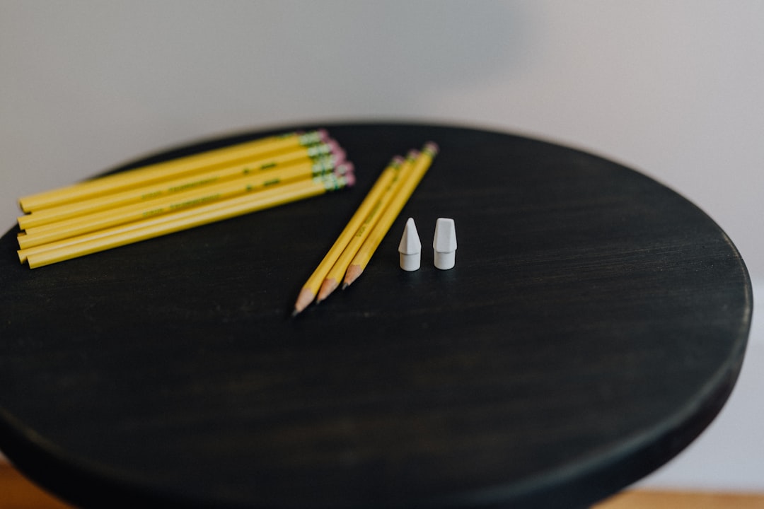 A crisp, bright flat lay featuring the 7 best pencil erasers from Pentel and Tombow neatly arranged