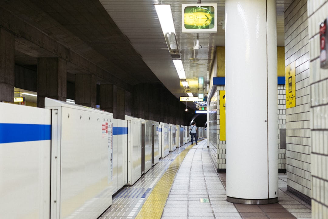 Photo of Japanese engineers or craftsmen working on Marantz audio components in a clean, high-tech f