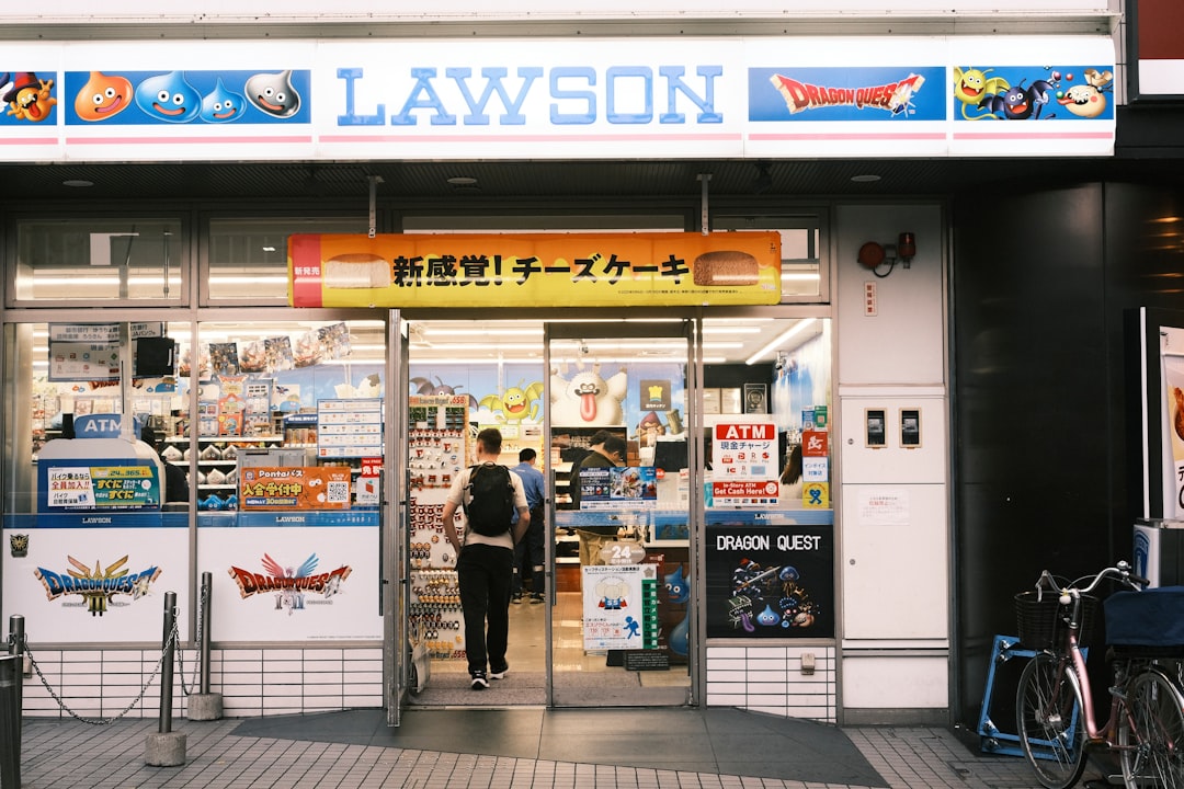 A sleek, minimalist flat lay of SK-II's signature Facial Treatment Essence bottle alongside traditio