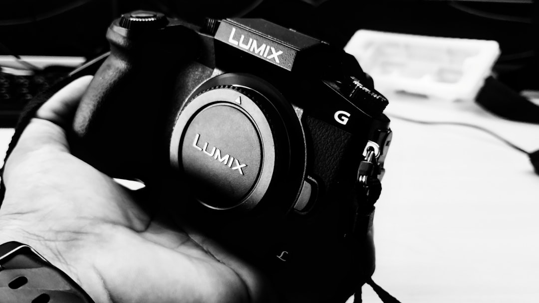 Close-up image of the Panasonic Lumix GH6 in an outdoor setting, showcasing its robust magnesium all