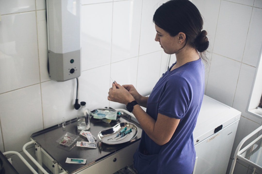 Lifestyle image showing a woman with clear, hydrated skin gently applying serum to her face in a bri