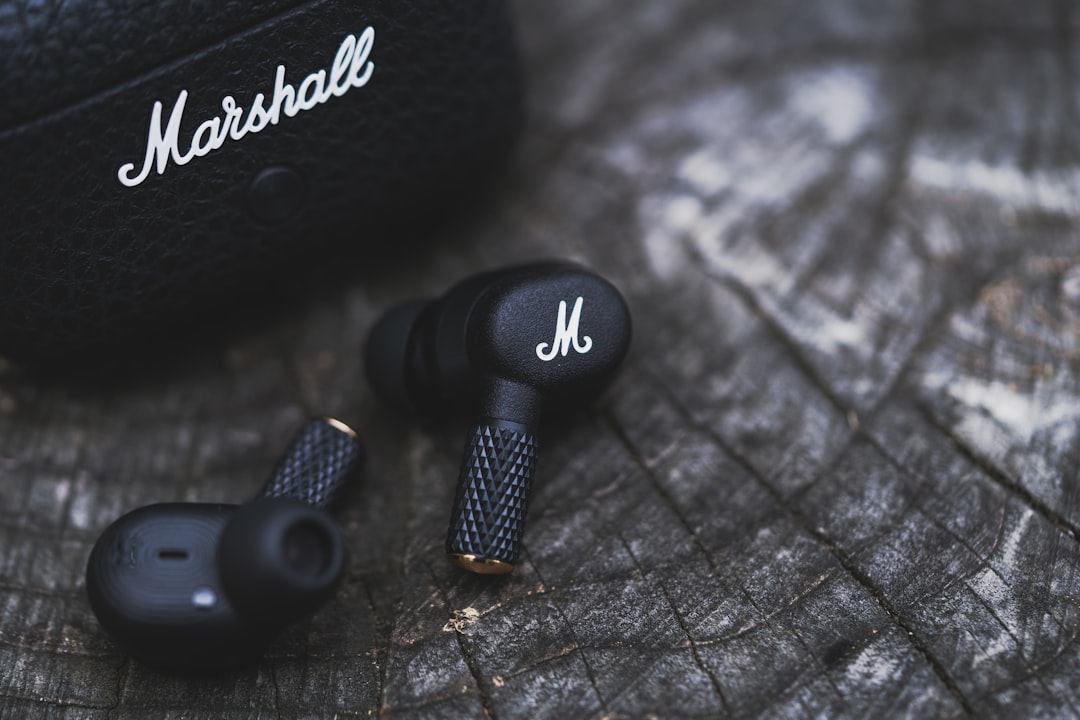 Close-up image of Sony WH-1000XM5 headphones showing design details and ear cushions to illustrate c