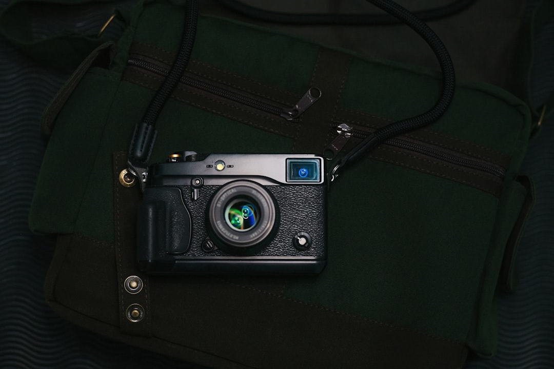 Diagram-style or creative flat-lay image illustrating essential travel photography gear: camera, ext
