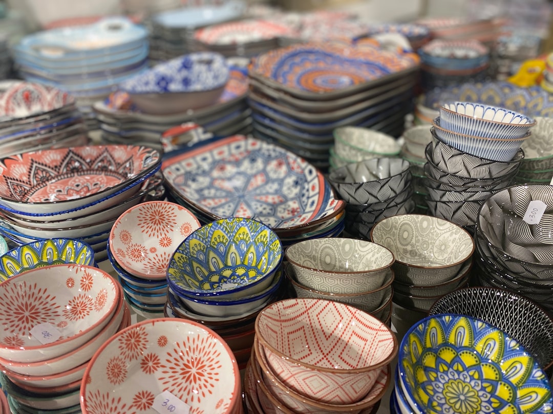 Close-up images of four distinct traditional Japanese ceramic styles: Imari (blue and red intricate 