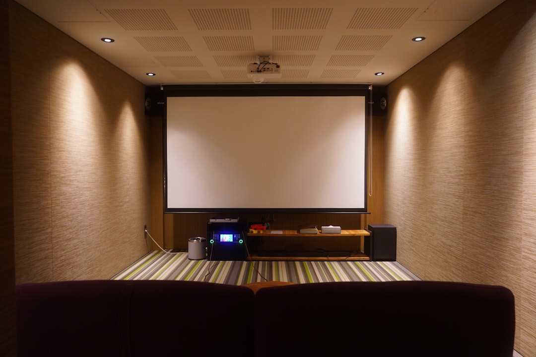 Lifestyle image showing a compact home theater setup featuring the slim Marantz NR1711 receiver plac