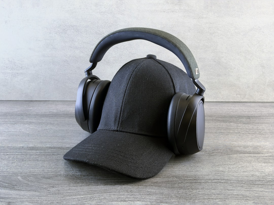 A sleek, high-resolution hero image showing a pair of Audio-Technica wireless headphones (preferably