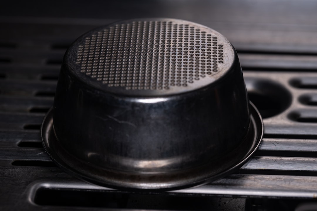Lifestyle shot of an American home cook using the Tiger cast iron grill pan on a modern induction st